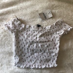 Ruched/scrunched off the shoulder